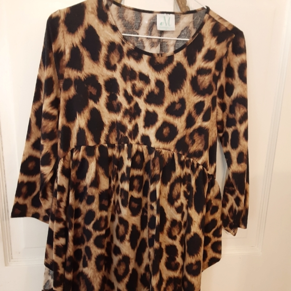 Shop the Mint animal print tunic. Medium
